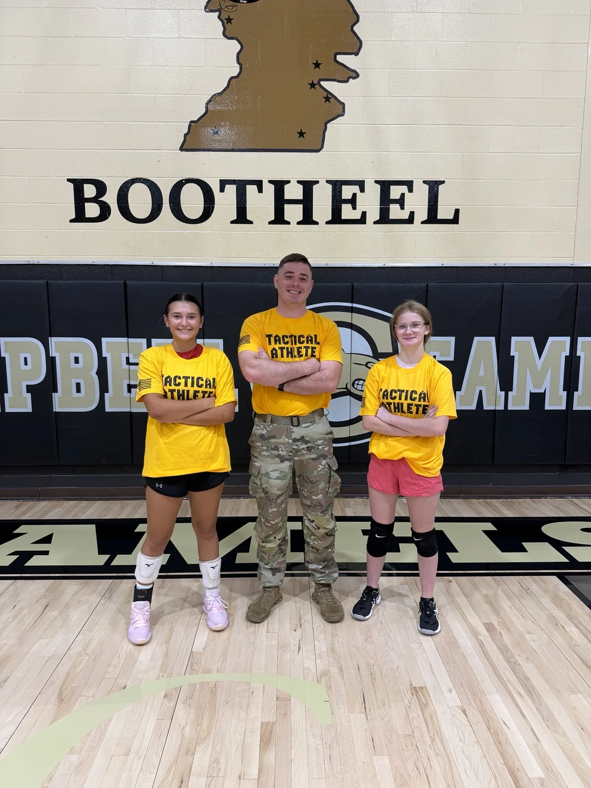SGT Barks with students wearing tactical athlete shirts