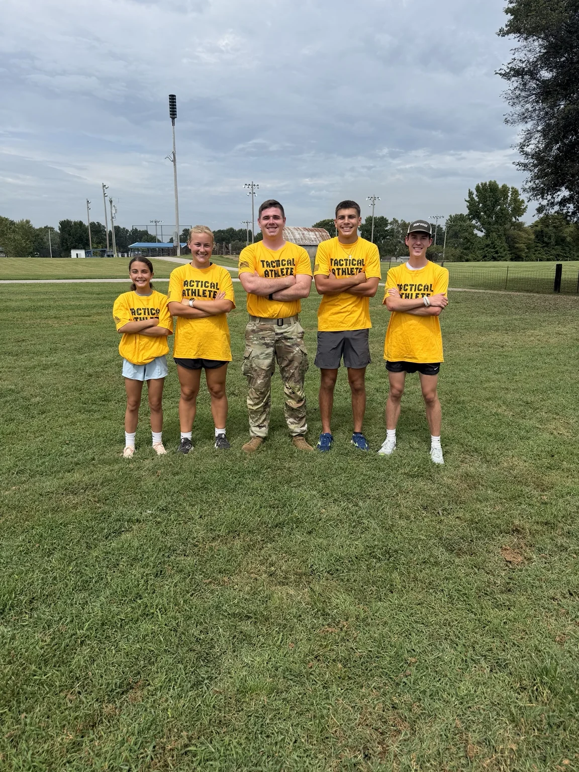SGT Barks with student athletes after an outdoor workout